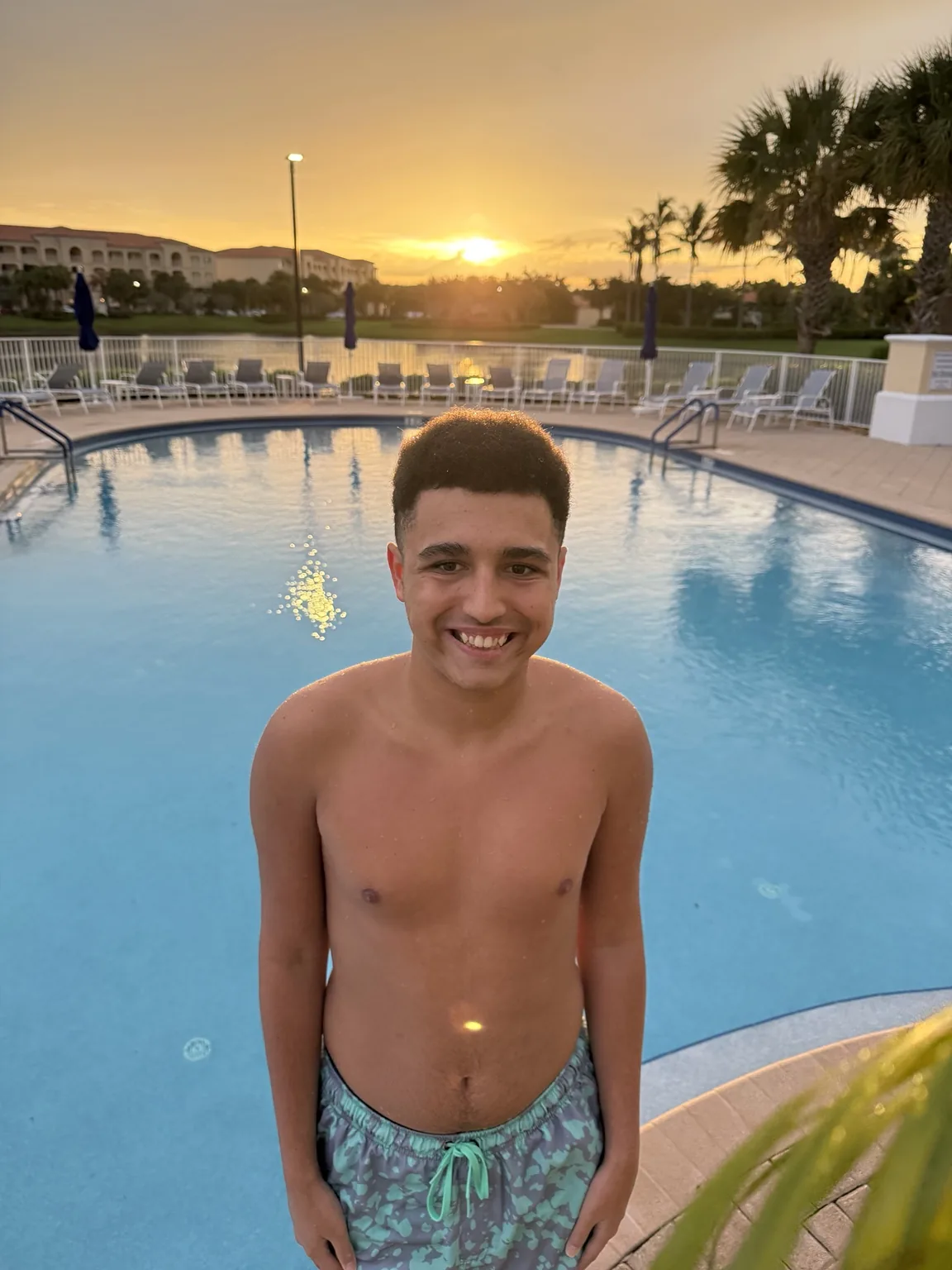 Evan at a pool at sunset